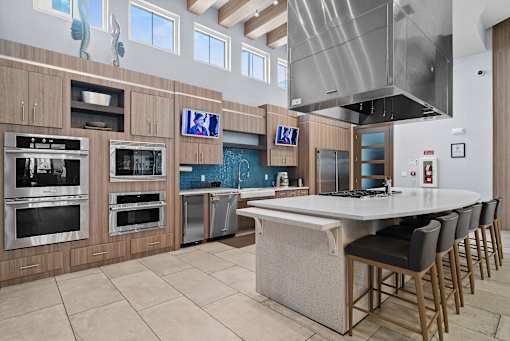 A modern kitchen with a large island and stainless steel appliances. at Centre Pointe Apartments, Melbourne, 32940