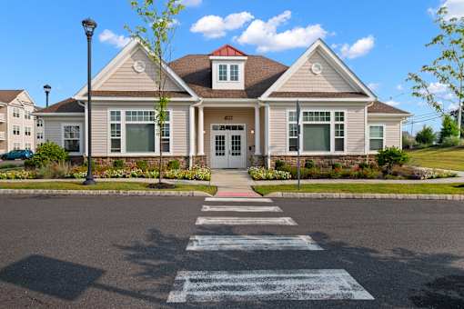 a house with a cross walk in front of it at The Landing Apartment , Hazlet, NJ