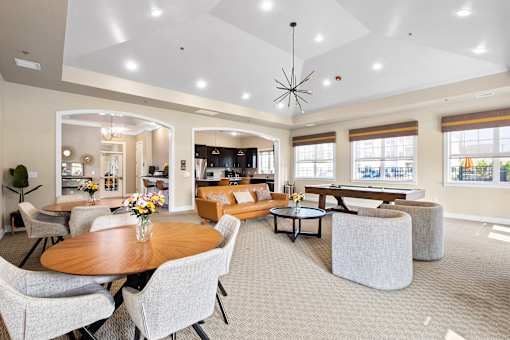 a living room with couches and chairs and a table at The Landing Apartment , Hazlet, New Jersey