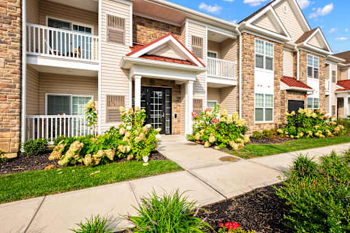 a sidewalk in front of an apartment building at The Landing Apartment , New Jersey, 07730