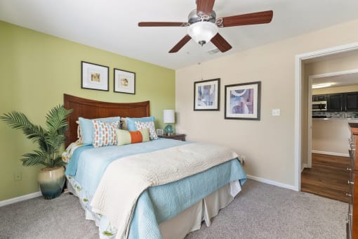 a bedroom with a bed and a ceiling fan at 150 Summit, Birmingham