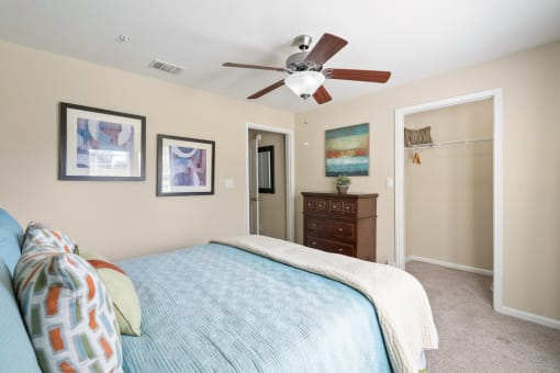 a bedroom with a bed and a ceiling fan at 150 Summit, Birmingham, AL, 35243