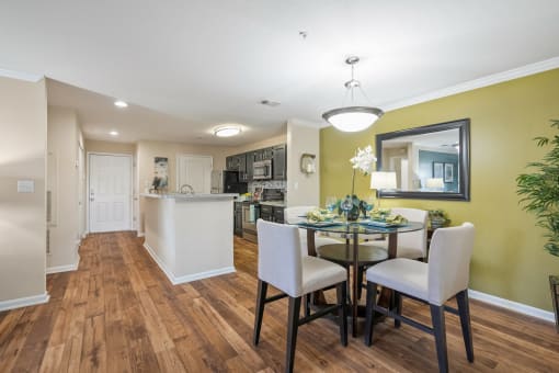 a dining room and kitchen with a table and chairs at 150 Summit, Birmingham