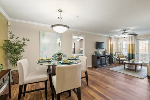 a living room and dining room with a table and chairs at 150 Summit, Birmingham, AL, 35243