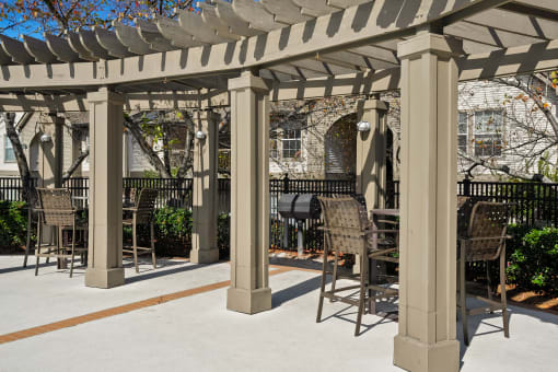 a gazebo with tables and chairs on a sidewalk at 150 Summit, Birmingham, 35243