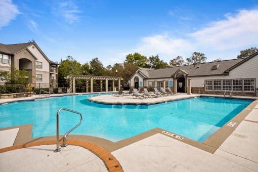our apartments have a resort style pool with lounge chairs at 150 Summit Apartments, Alabama