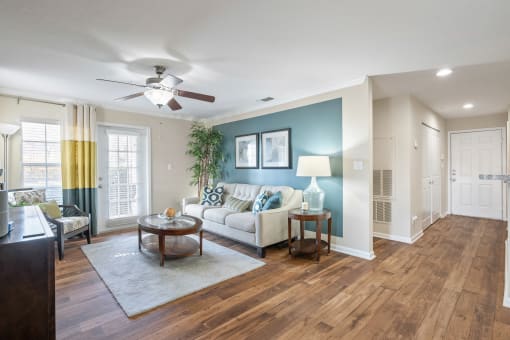 a living room with a couch and a ceiling fan at 150 Summit, Birmingham, 35243