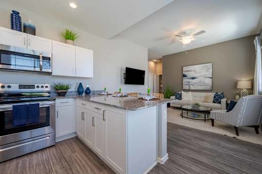 Open concept kitchen and living room at Vistoria On Mountain View Apartments, Arizona, 85374