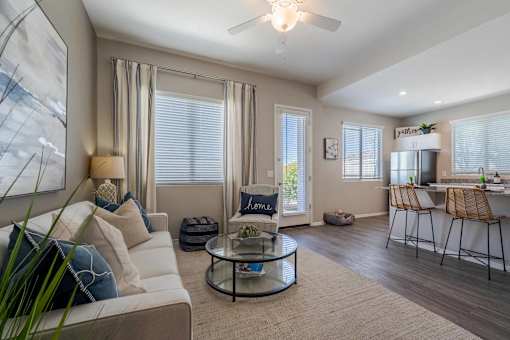 Contemporary living room with sectional sofa at Vistoria On Mountain View Apartments, Surprise, AZ