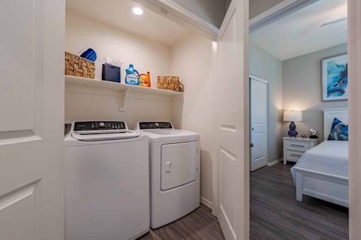 In unit laundry room with white appliances at Vistoria On Mountain View Apartments, Arizona