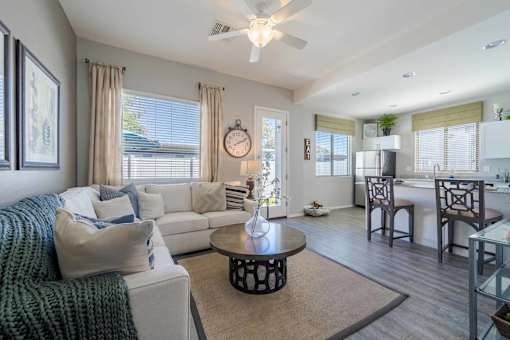 Modern apartment living room with sectional sofa at Vistoria On Greenway Apartments, Surprise, Arizona