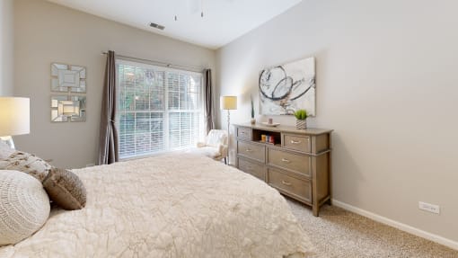 a bedroom with a large bed and a window