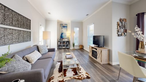 a living room with a couch and a tv