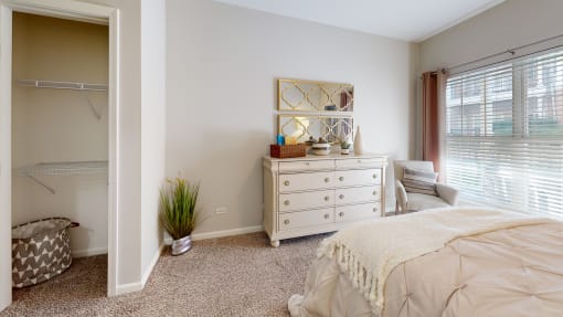 a bedroom with a bed and a dresser