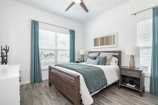 a bedroom with a bed and a ceiling fan at Artesia at Lakewood Ranch Apartments, Bradenton, 34211