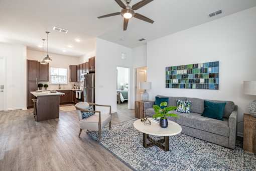 a living room with a couch and a coffee table at Artesia at Lakewood Ranch Apartments, Florida 34211