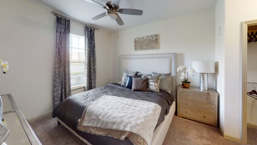 a bedroom with a bed and a ceiling fan at Integra 360 Apartments, Florida, 32708