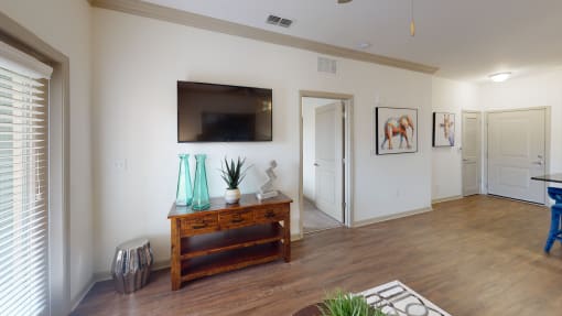 a spacious living room with a flat screen tv at Integra 360 Apartments, Winter Springs, FL