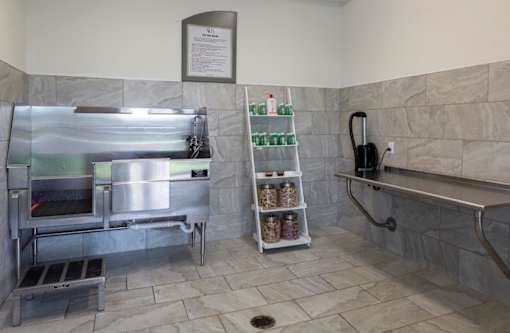 a small kitchen with a stove and a sink at The Addison on Long Bayou Apartments, Seminole