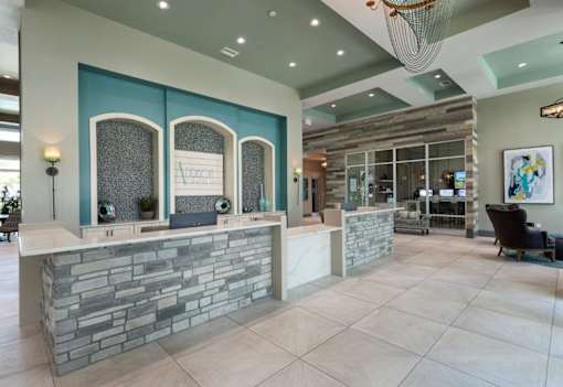 the lobby of a spa with a reception desk at The Addison on Long Bayou Apartments, Seminole, FL, 33772