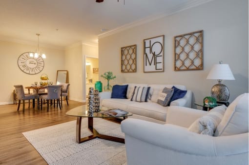 a living room with two couches and a coffee table at Magnolia Village Apartments, Jacksonville, Florida