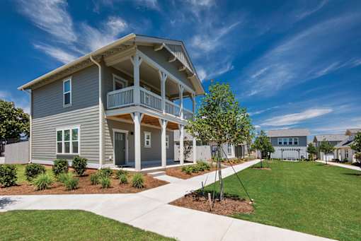 corner exterior view of two story home at The Cottages at Old Monrovia Apartment , Huntsville, AL