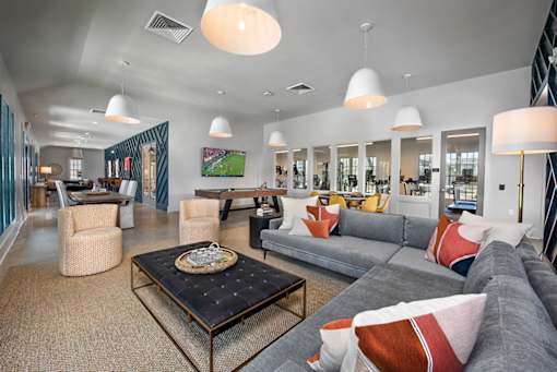 clubhouse with couch seating at The Cottages at Old Monrovia Apartment, Huntsville, AL, 35806
