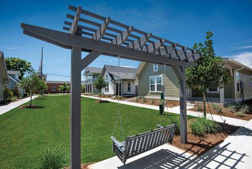 courtyard with bench swing at The Cottages at Old Monrovia Apartment , Huntsville, AL