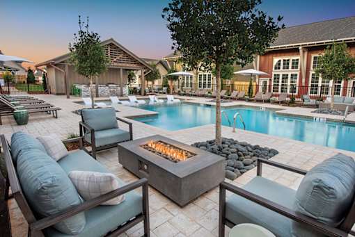 fire pit by the pool at The Cottages at Old Monrovia Apartment , Alabama, 35806