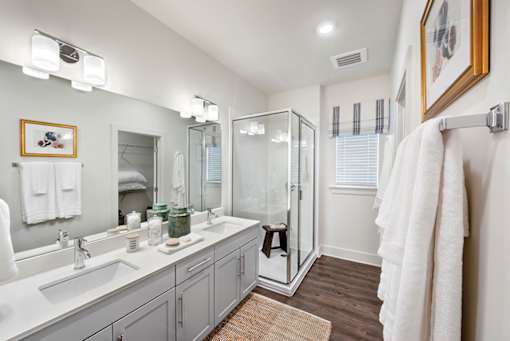 Bathroom with glass shower at The Cottages at Old Monrovia Apartment, Huntsville, AL, 35806