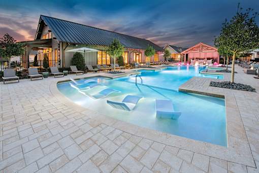 night view of pool with seating at The Cottages at Old Monrovia Apartment , Huntsville, 35806