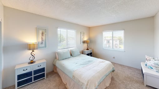 a bedroom with a bed and two night stands at Park 88 Apartments, Thornton