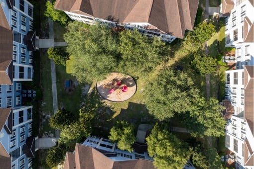 a birdseye view of a park with people sitting on the grass at Magnolia Village Apartments, Jacksonville, FL, 32207