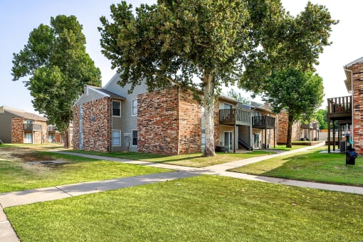 our apartments have a spacious courtyard with trees and grass at Diamond  Trail Apartments, Oklahoma City, 73112