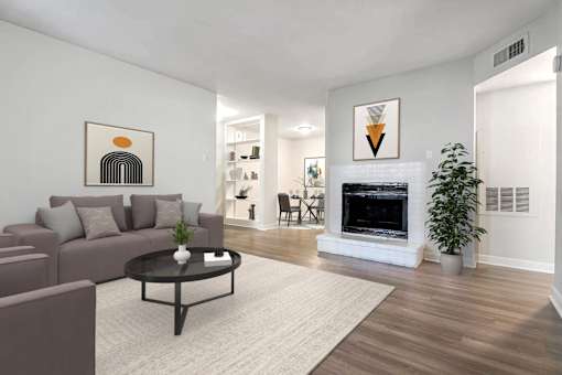 A living room with a fireplace and a couch.