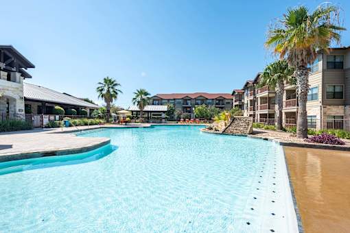 Legacy Brooks Swimming Pool with Palm Trees  at Legacy Brooks, 78223
