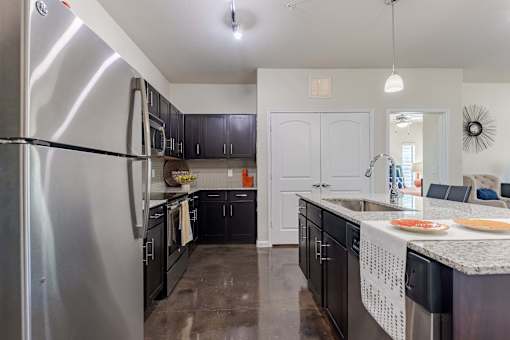 Kitchen Island with Stainless Steel Appliances and Cabinetry  at Legacy Brooks, 78223