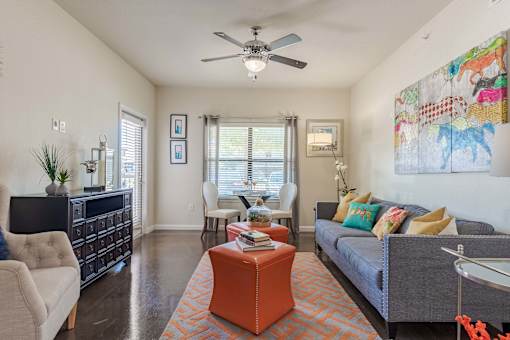 living room with furniture and a ceiling fan  at Legacy Brooks, San Antonio, 78223