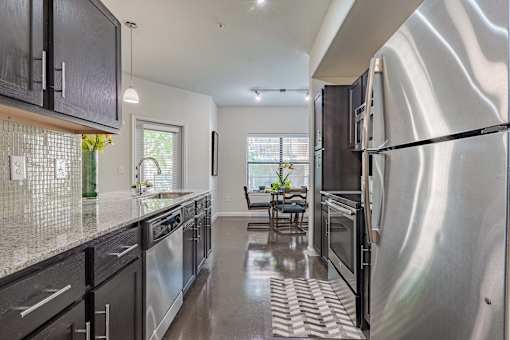 Dining Room With Kitchen View at Legacy Brooks, San Antonio, 78223