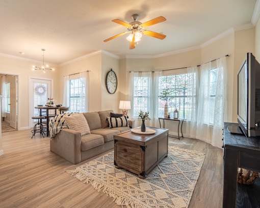 Living room with a couch and coffee table at Park Hudson Place Apartments, Bryan, TX, 77802