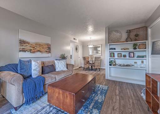 Living room with a couch and a coffee table  at Riverstone, Texas, 77802
