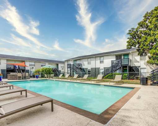 Swimming pool with relaxing sunbeds at The Wick, Texas