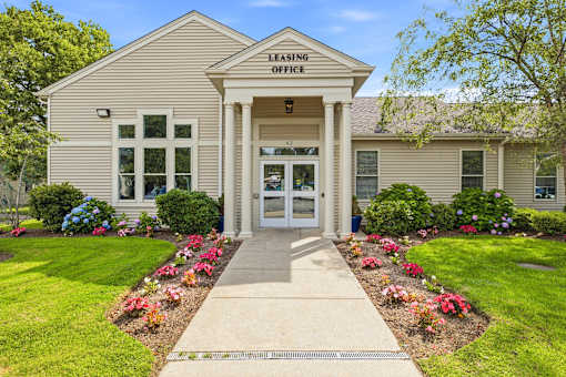 A building with a LEASING OFFICE sign on the front.