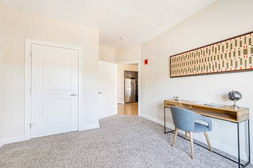 A room with a desk and chair in it. at Axis at Lakeshore, Bridgewater, MA, 02324