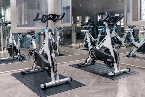 A Spinning bike is on display in a gym.