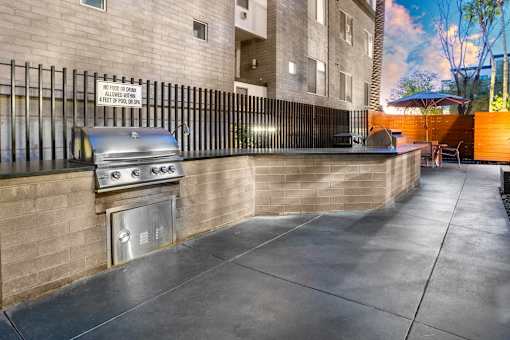 A sign on a fence states "No food or drinks allowed on balcony.".