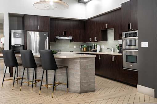 A modern kitchen with dark wood cabinets and a central island.
