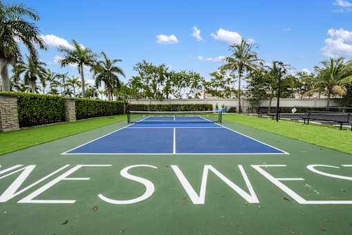 A tennis court with the word "TENNIS" written on it.