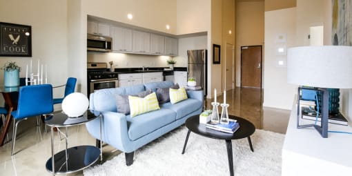 staged living room with view of kitchen