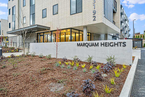 an image of the front of the magnum heights apartments building